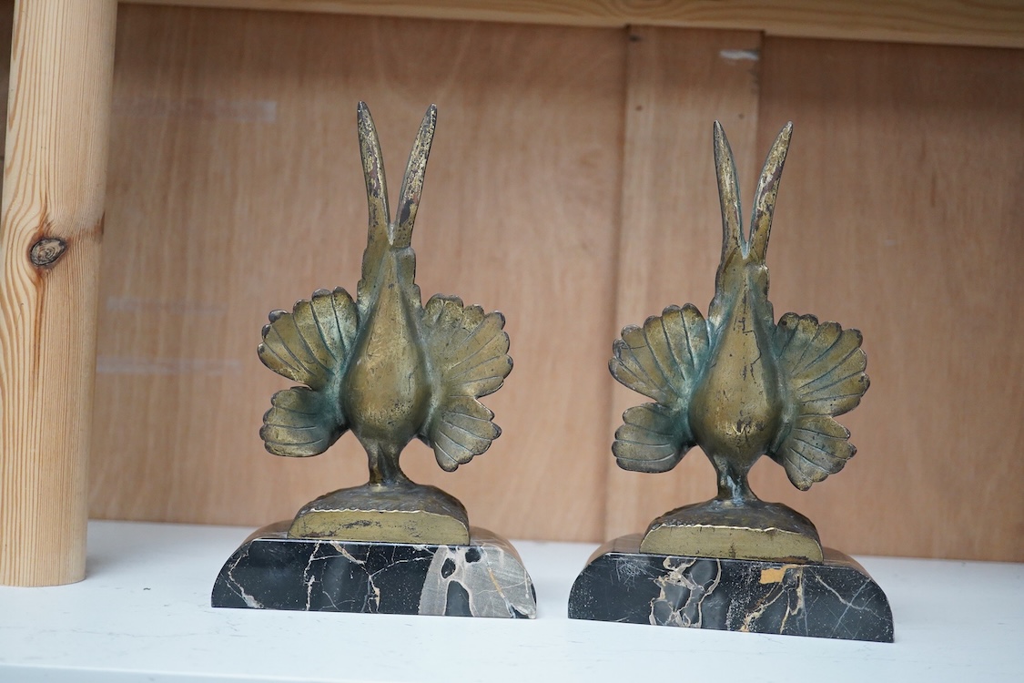A pair of bronze peacock bookends, with remains of coloured pigments, marble plinths, signed R. Leclerc, 20cm